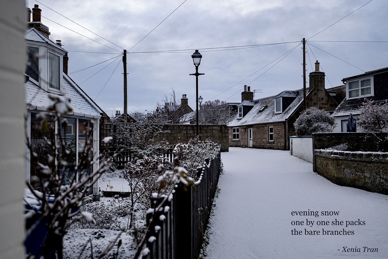 fishermen's cottages in the snow with a haiku by Xenia Tran